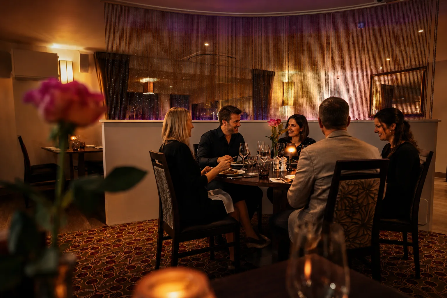 Guests dining by candlelight in The Orchard dining room